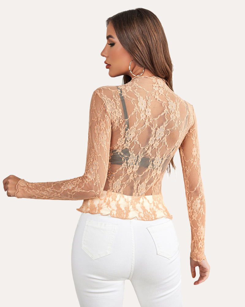 Peach floral lace mock neck sheer blouse with long sleeves on a woman, stylish and sexy mesh top