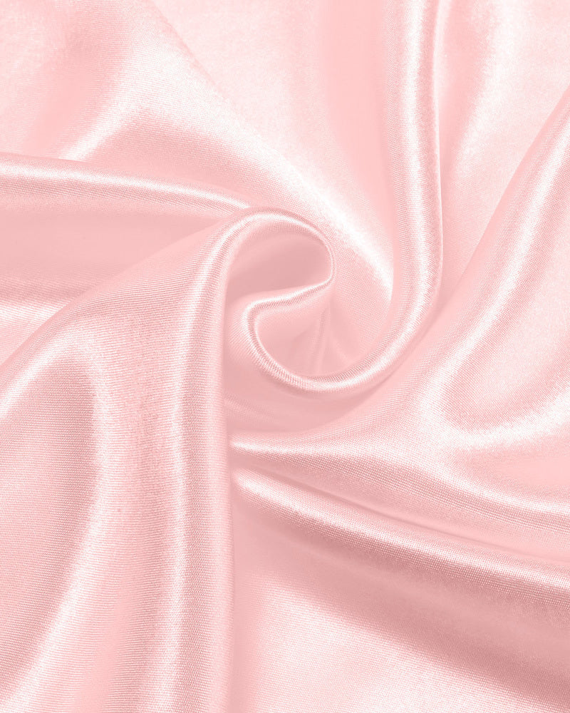 Pink satin fabric detail. Soft, shiny material, ideal for a comfortable slip dress or lingerie.