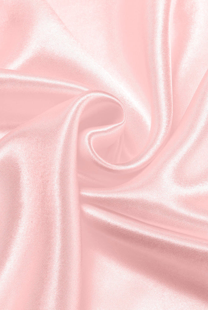 Dusty rose satin fabric detail for sleepwear, showcasing smooth texture and sheen by Avidlove