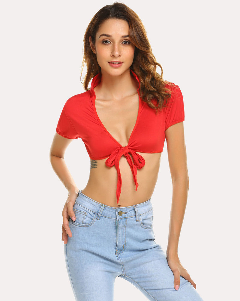 Red tie-up crop top, deep V-neck, short sleeves, and light wash jeans for cosplay.