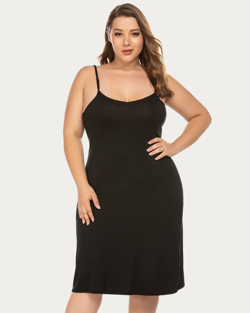 Black slip dress with V-neck and spaghetti straps. Above knee length lingerie by Avidlove.
