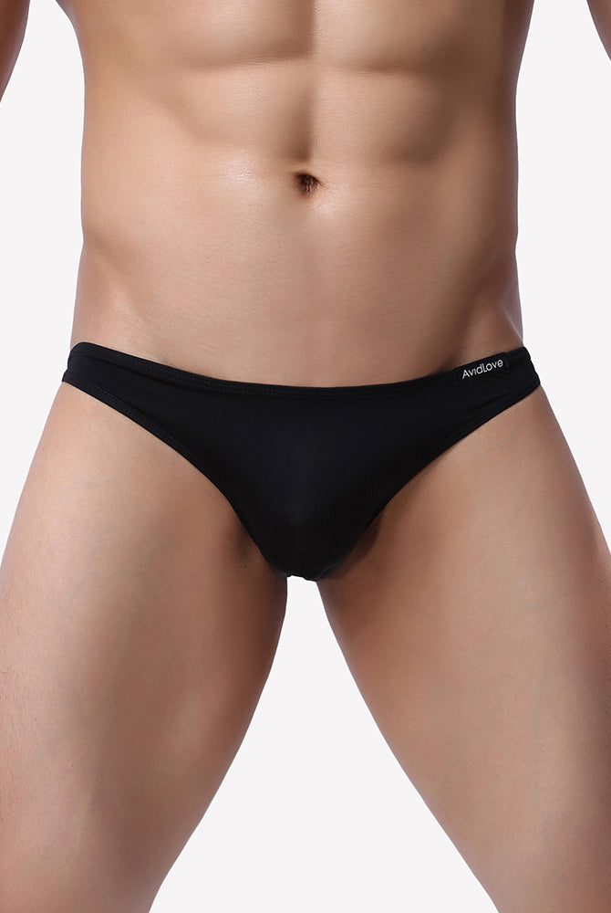 Men's low-rise stretch briefs, black, front view on model