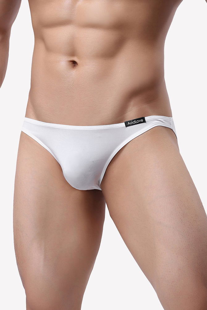 Men's low-rise briefs in white on model with elastic waistband