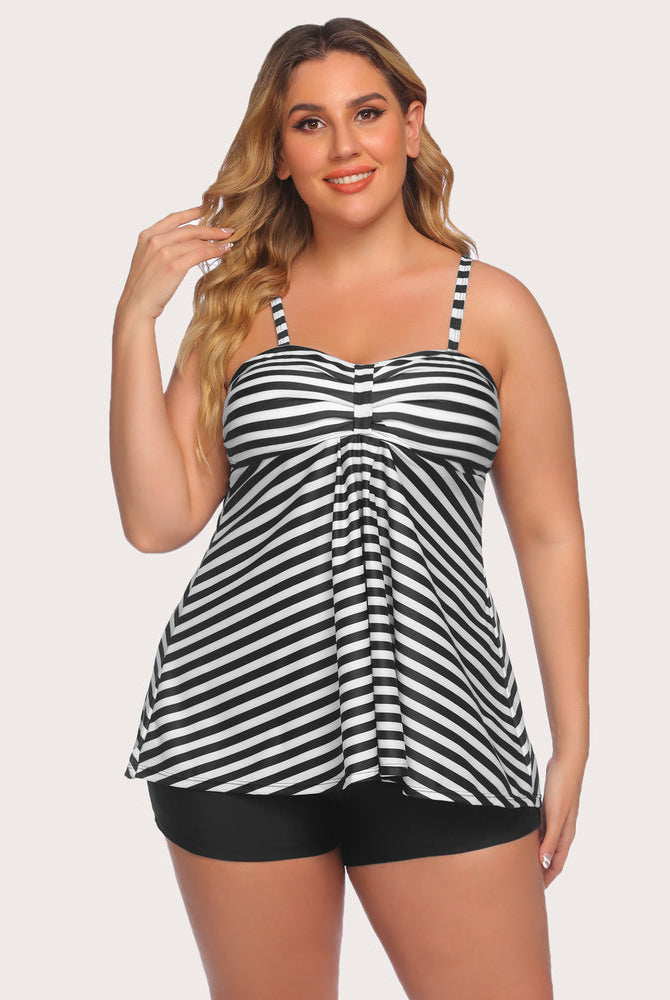 Striped tankini swimsuit. Black and white top with adjustable straps and black swim shorts.
