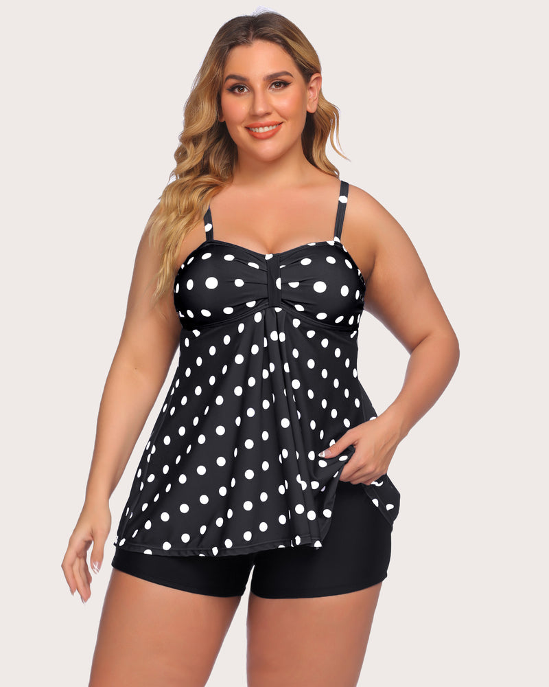 Polka dot tankini swimsuit for women, adjustable straps and black swim shorts. Stylish swimwear.