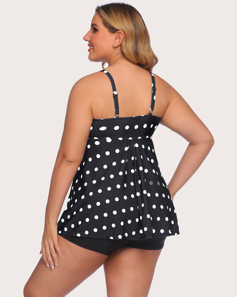 Polka dot tankini swimsuit set for women with adjustable straps and black swim shorts.