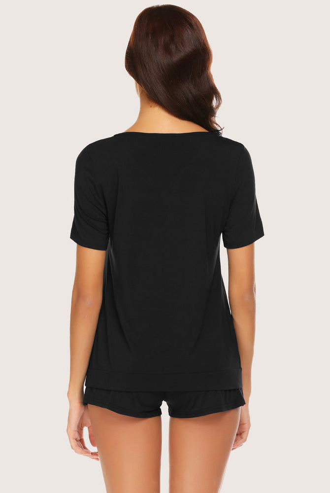 Black short sleeve pajama set for women, soft rayon and spandex blend. Comfortable sleepwear.