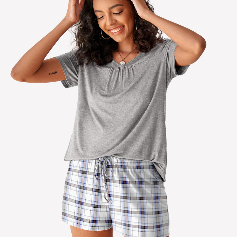 Grey short sleeve pajama set with checkered shorts. Women's soft and comfortable loungewear.