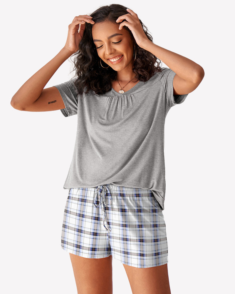 Grey short sleeve pajama set with checkered shorts. Women's soft and comfortable loungewear.