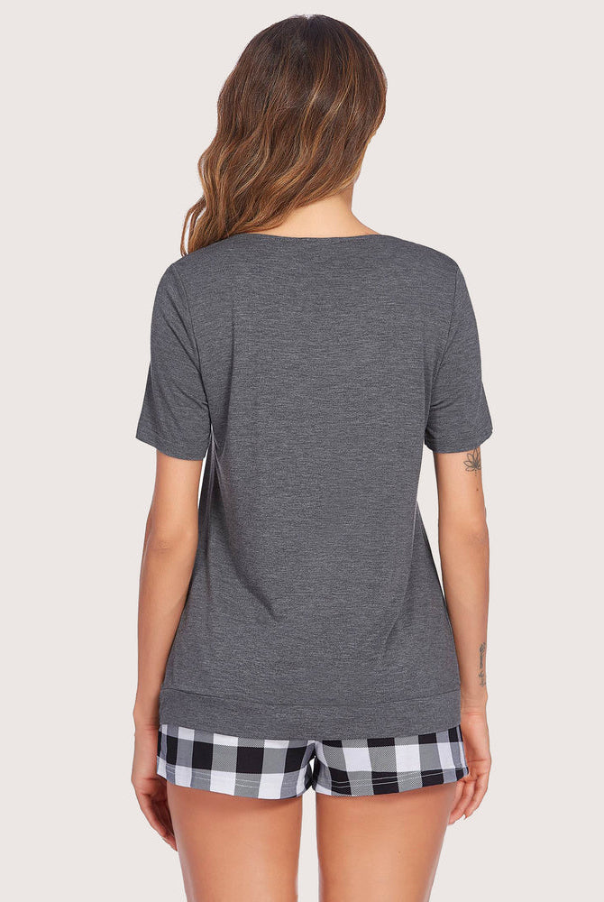 Gray short sleeve pajama set, checkered shorts. Soft, breathable loungewear for women.