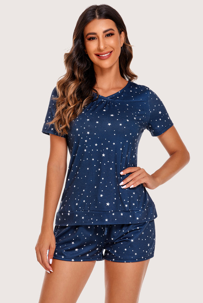 Navy blue star-print short pajama set for women. Comfortable sleepwear with rayon and spandex blend.