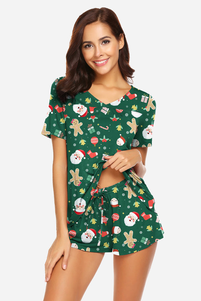 Green Christmas pajama set. Soft rayon blend. Comfortable women's sleepwear with festive print.