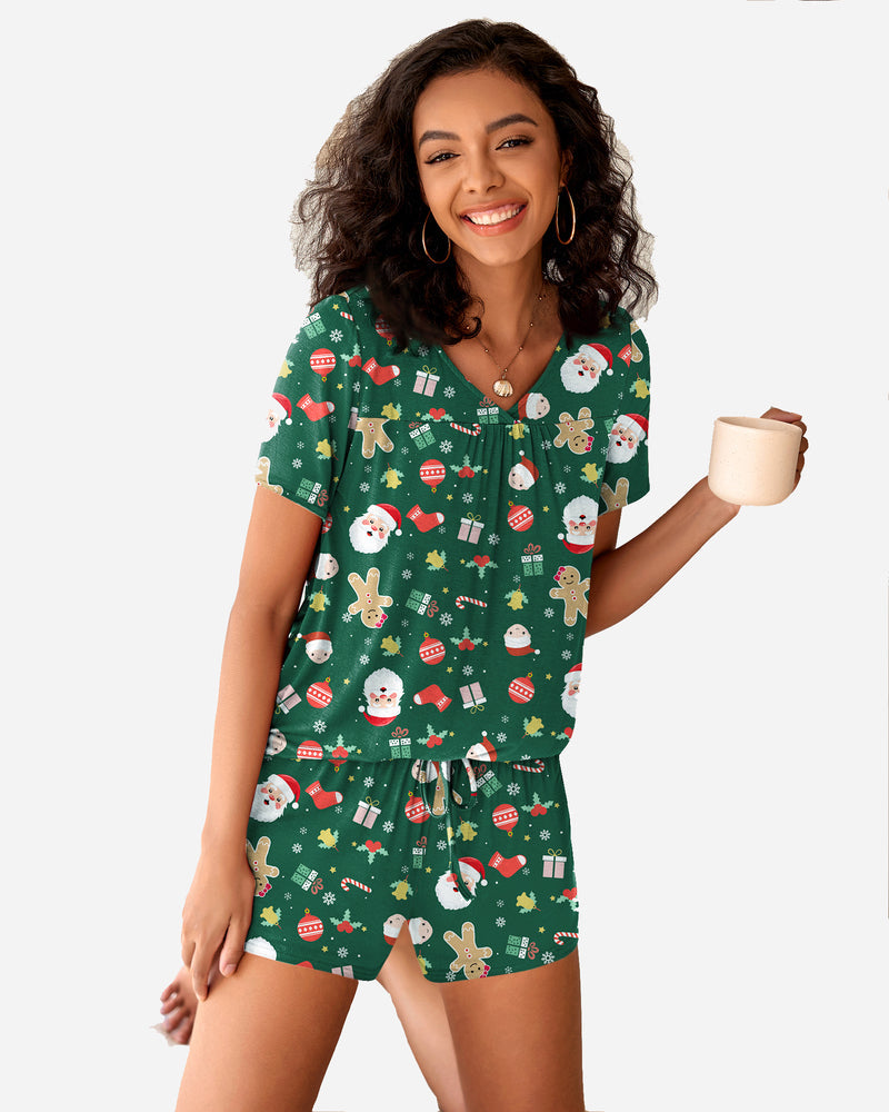 Green Christmas pajama set with holiday print. Comfortable women's sleepwear with soft rayon blend.