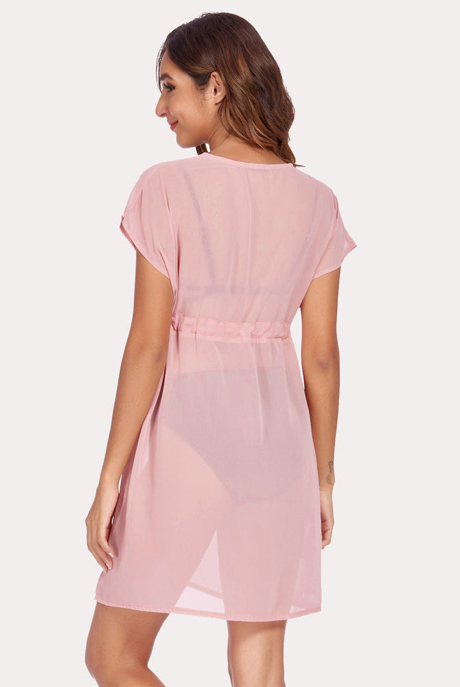 Light pink chiffon swimsuit cover-up with deep V-neck and drawstring waist. Summer beach essential.