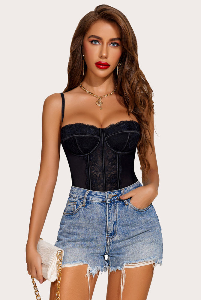 Black lace corset bustier top with adjustable straps and denim shorts, perfect for a night out.