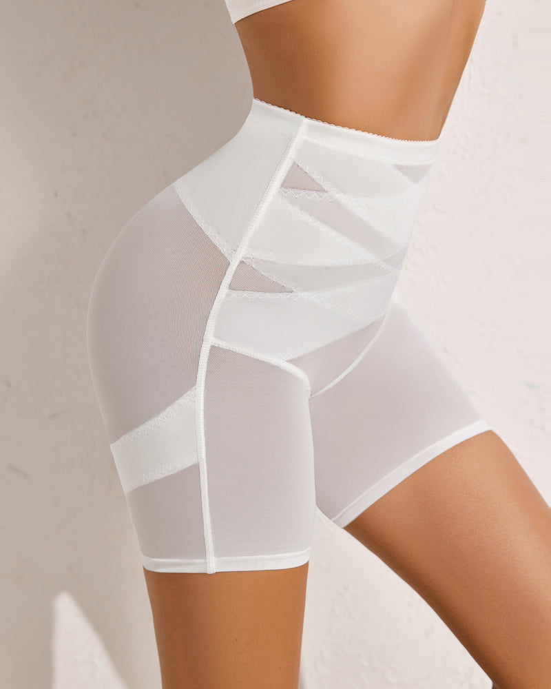 White high-waisted shapewear shorts with tummy control and butt lift, smoothing silhouette