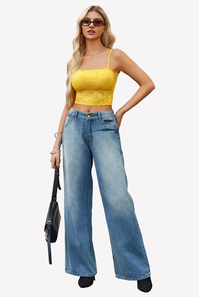 Yellow lace bralette with adjustable straps and blue jeans. Fashionable lingerie from Avidlove.