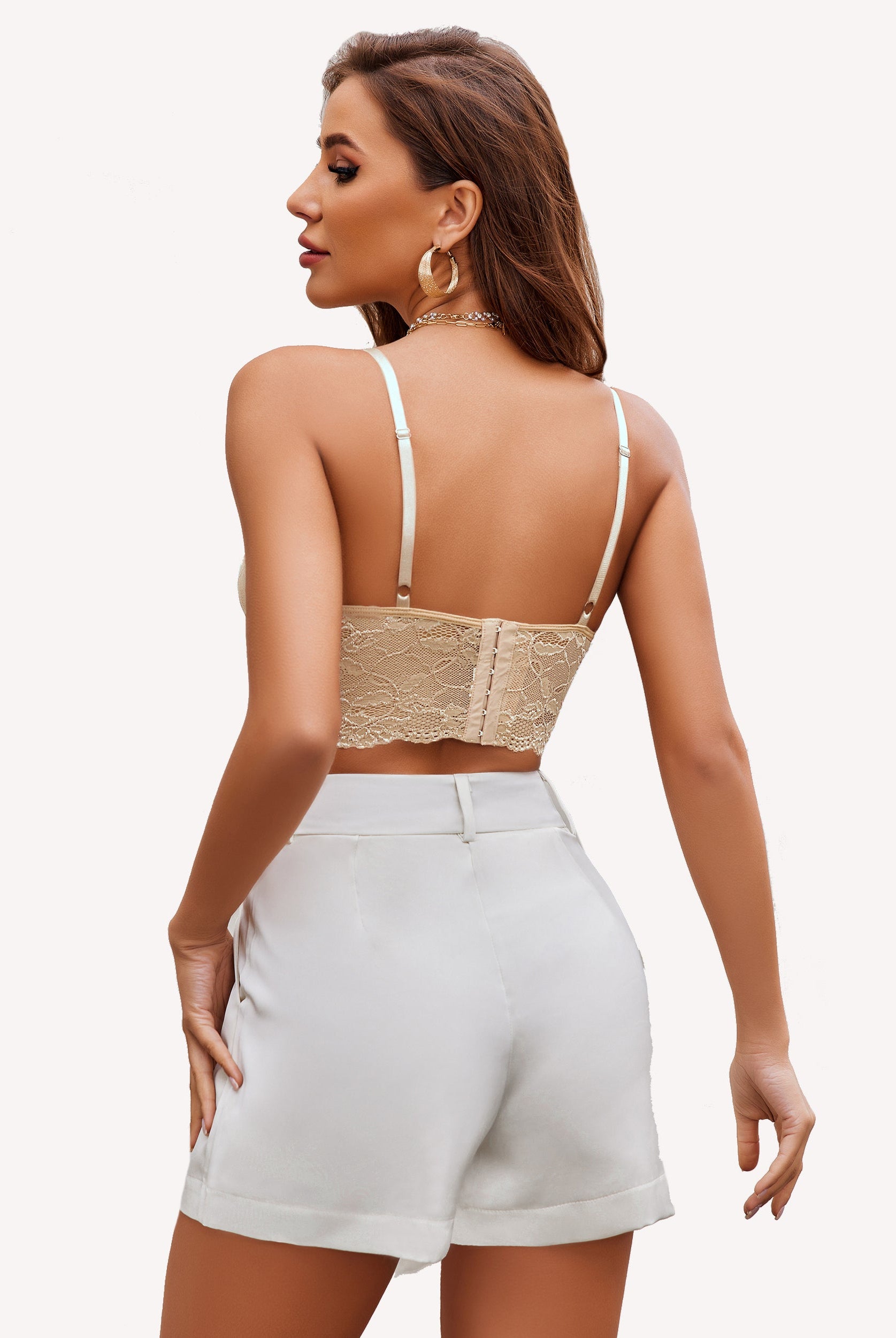 Beige lace bralette with adjustable straps and white shorts. Sexy lingerie for women.