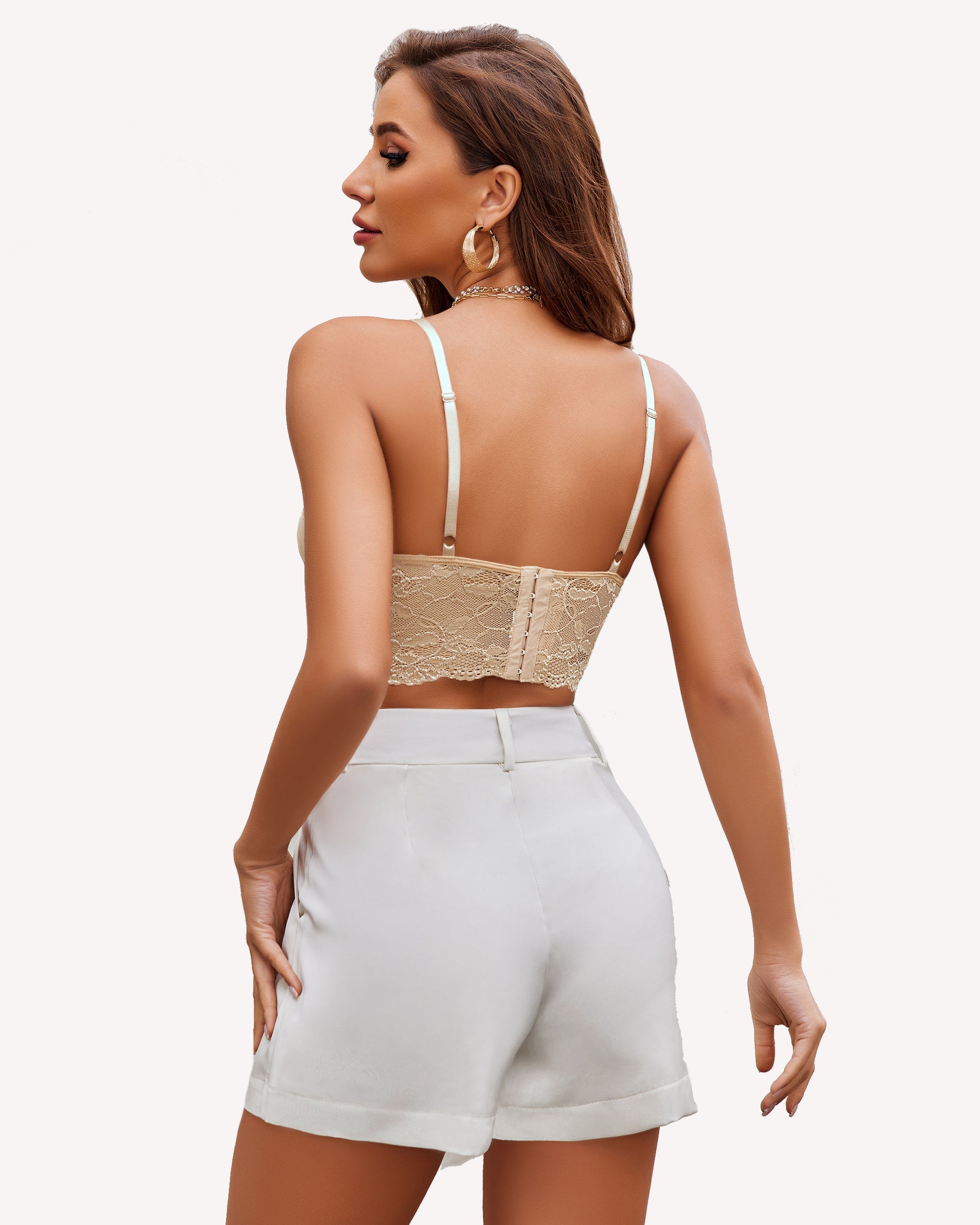 Beige lace bralette with adjustable straps and white shorts. Sexy lingerie for women.