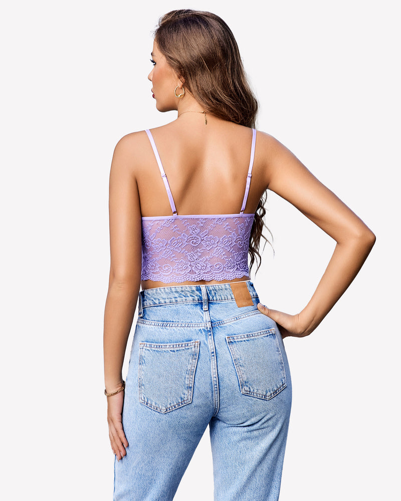 Lilac lace bralette top with spaghetti straps and light blue jeans. Sexy lingerie.