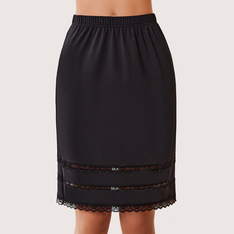 Black knee length half slip with floral lace trim and elastic waistband. Comfortable underskirt.