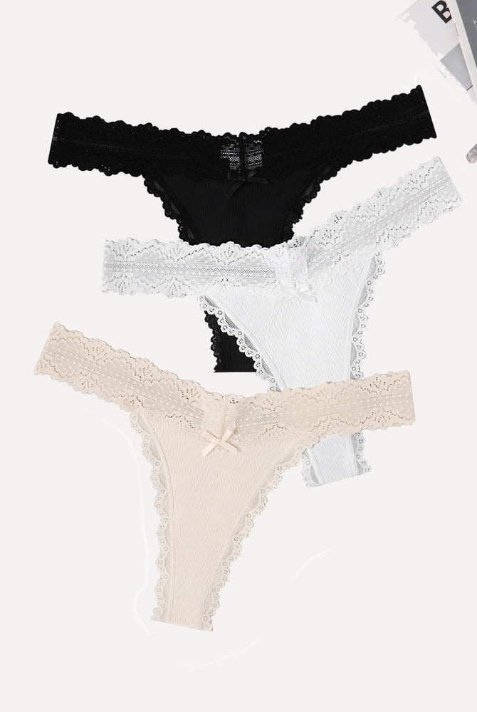 Avidlove thong panties set. Black, white, and beige with lace waist, ribbed fabric and bow.