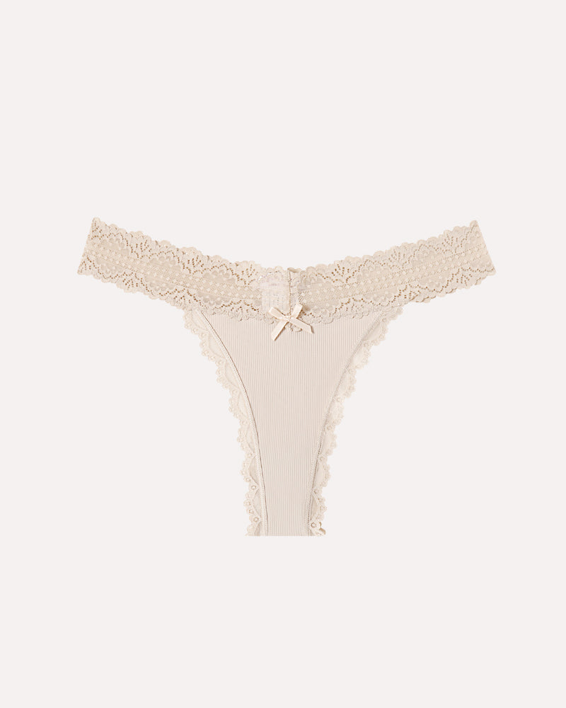 Beige Avidlove lace waist thong panties with ribbed fabric and bow detail. Sexy lingerie.