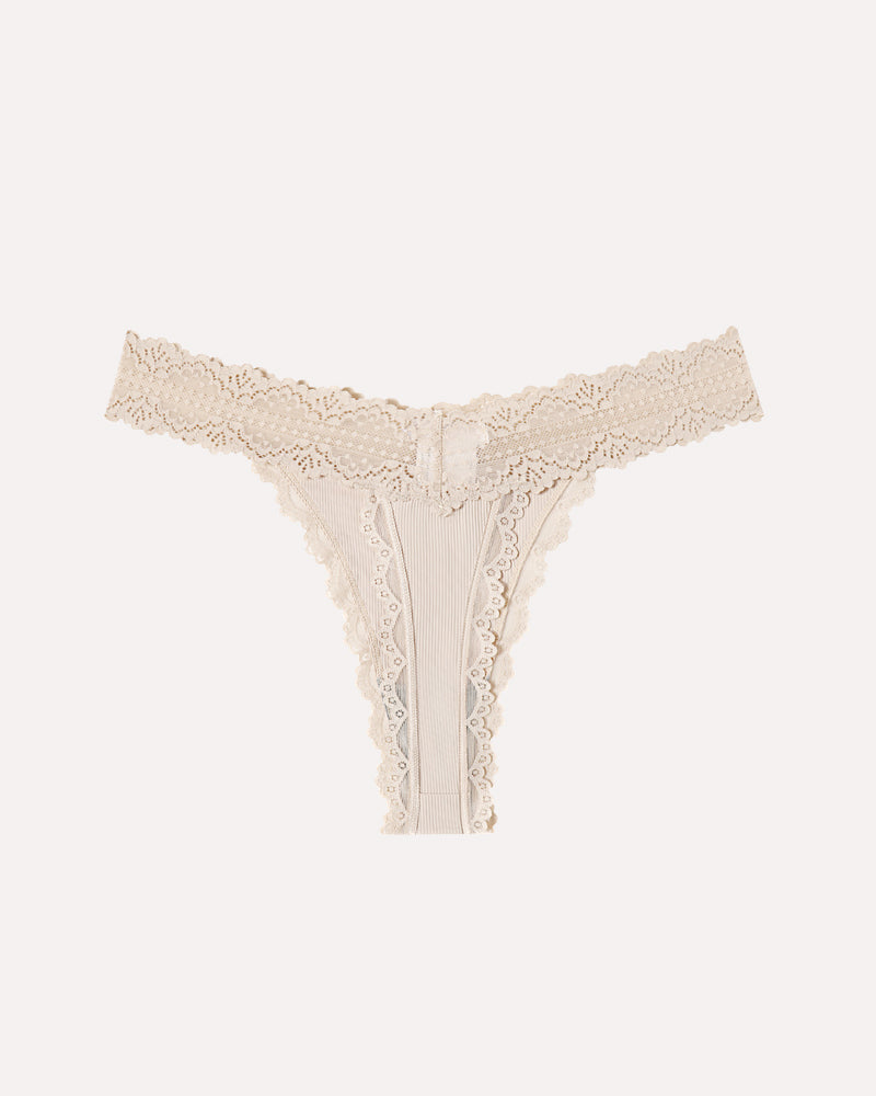 Beige lace waist thong panties with ribbed fabric and bow detail. Sexy Avidlove lingerie