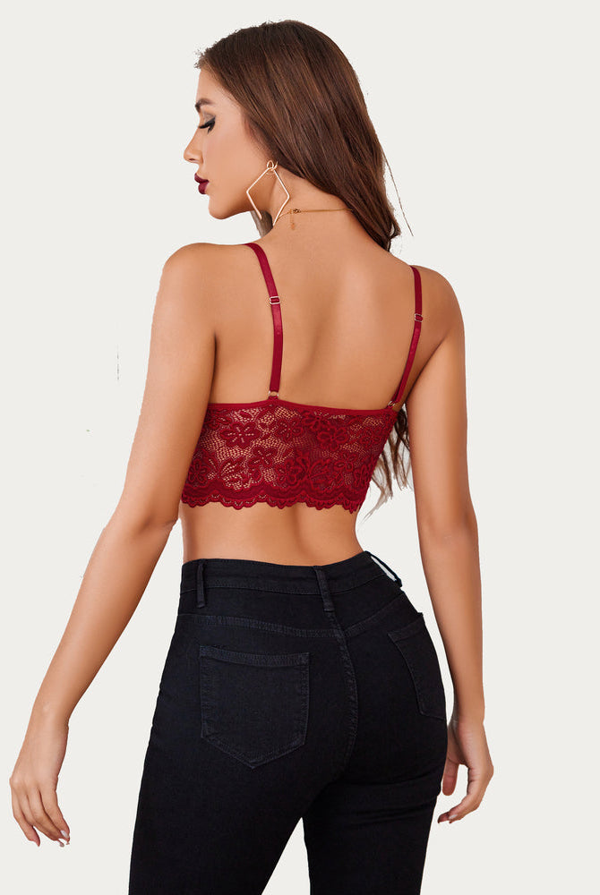 Burgundy lace bralette crop top with adjustable straps and black jeans. Sexy floral lace lingerie.