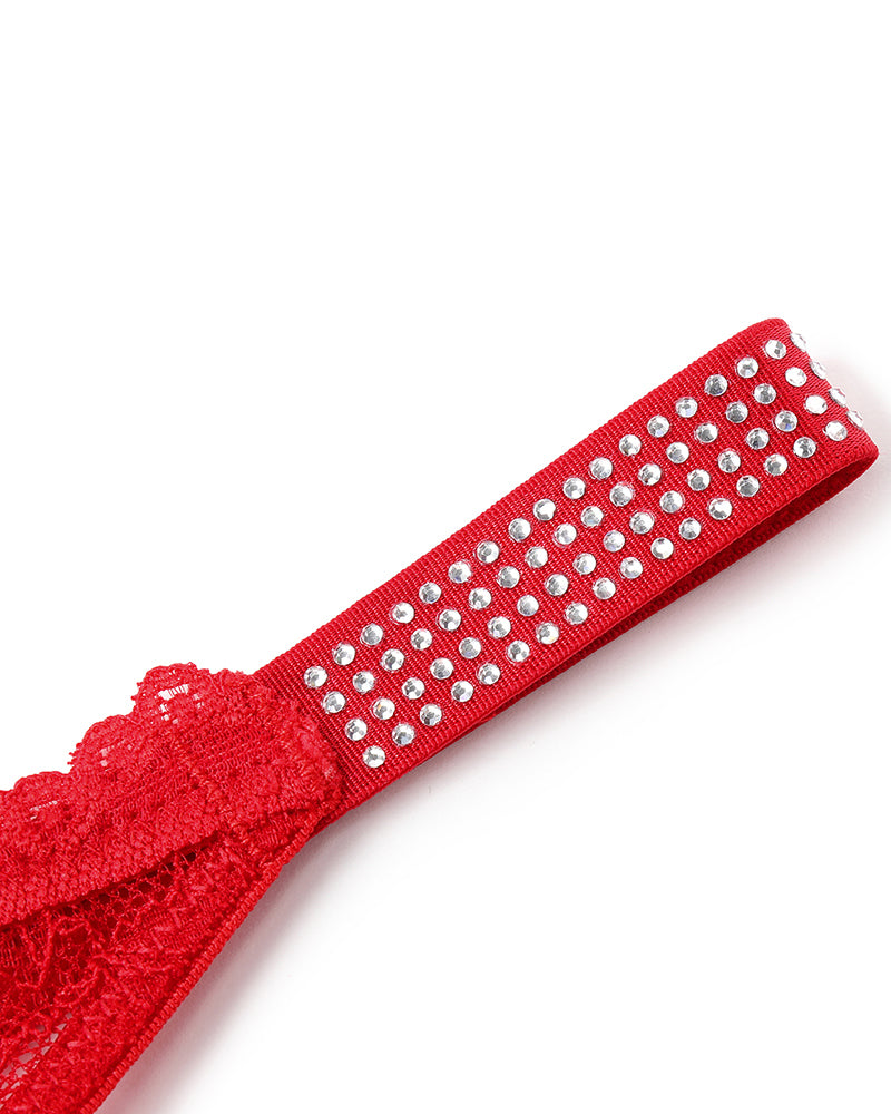 Red lace thong strap with rhinestone embellishments. Sexy lingerie with transparent lace.