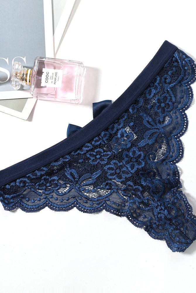 Dark blue lace bow thong panties. Low waist and floral lace design. Sexy lingerie for women.