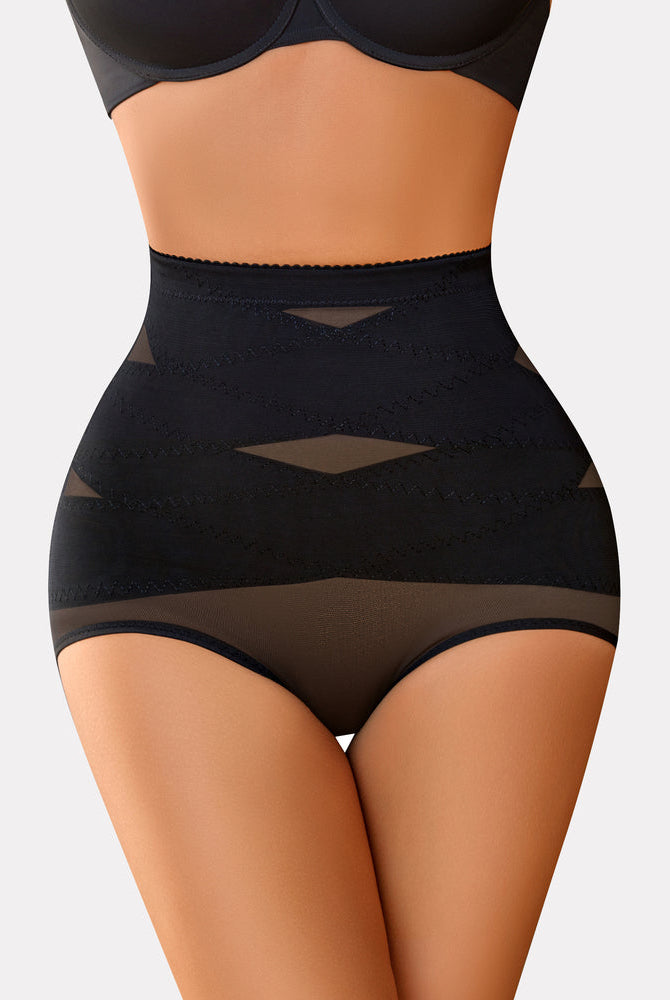 Black high-waisted tummy control thong, criss-cross design, for tummy flattening and shaping.