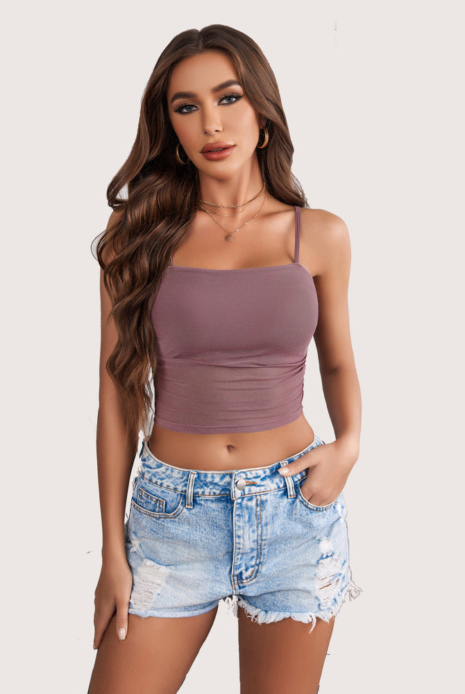 Mauve spaghetti strap tank top, square neck, paired with denim shorts, a flattering and stylish fit.