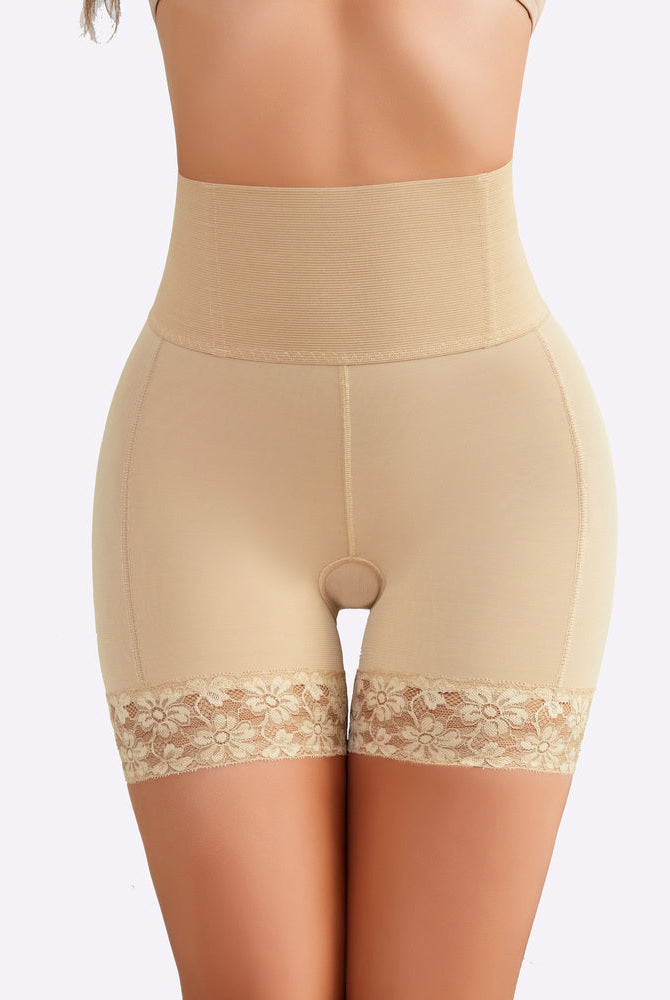 Beige high-waisted shapewear shorts with lace trim, tummy control, and smoothing effect on thighs