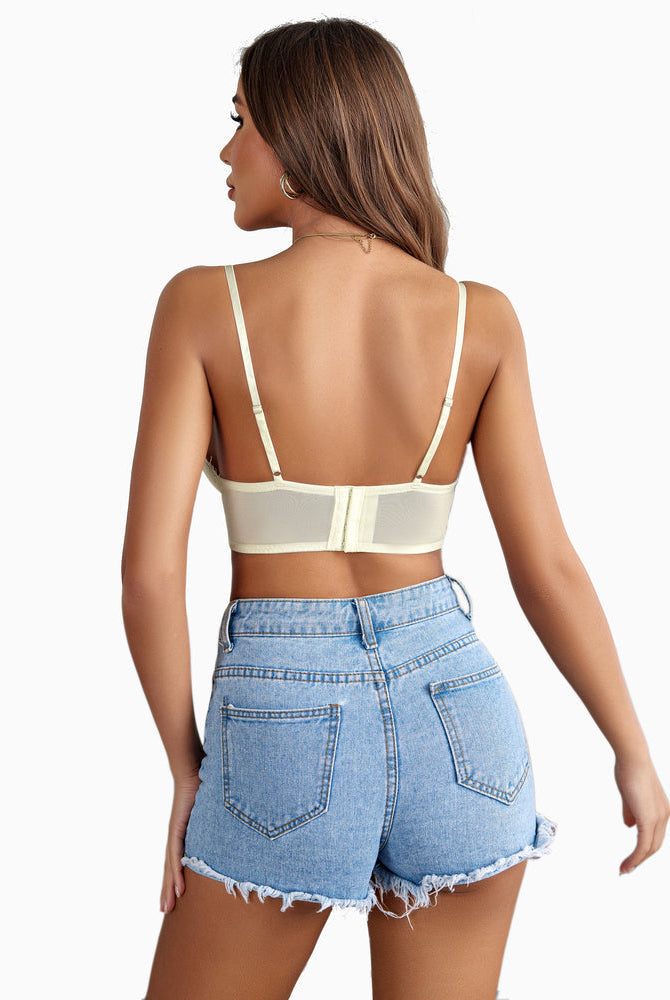 Cream lace bralette crop top, adjustable straps. Sexy lingerie. A-C cups. Paired with denim shorts.