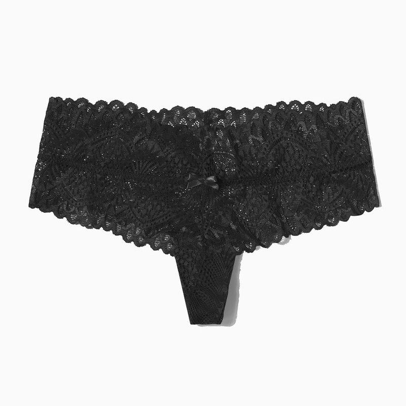 Black lace low-waist thong with floral pattern and bow, designed for comfort and a feminine touch.