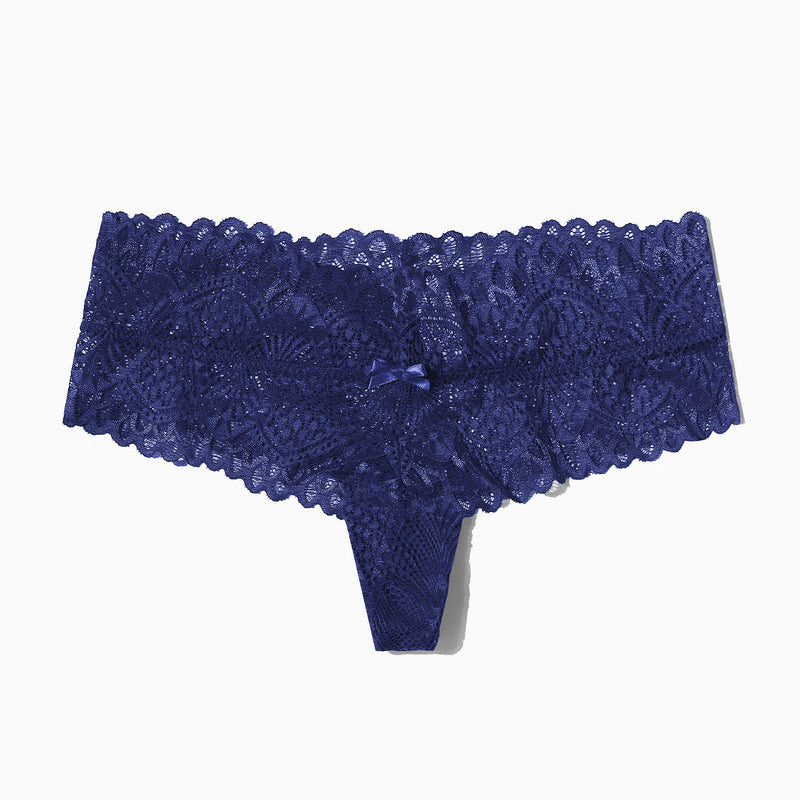Navy blue floral lace low-waist thong, feminine lingerie with bow detail.
