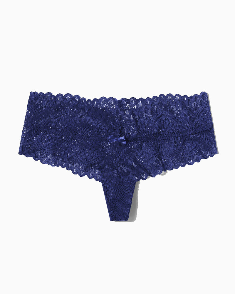 Navy blue floral lace low-waist thong, feminine lingerie with bow detail.