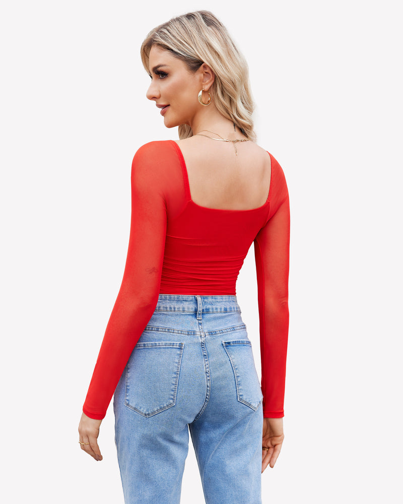 Red mesh bodysuit with square neck, ruched detail, long sleeves, and model in blue jeans.