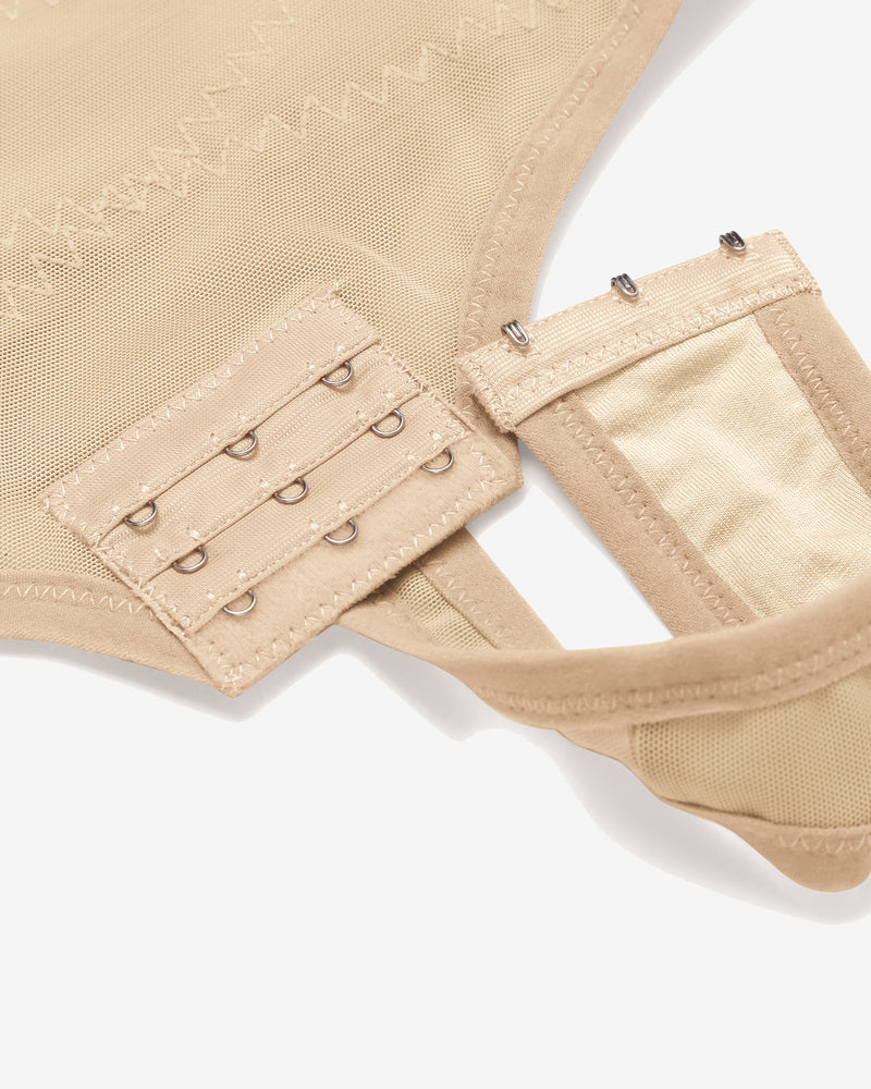 Beige tummy control shapewear: detailed view of hook closure, mesh fabric, high-waisted design