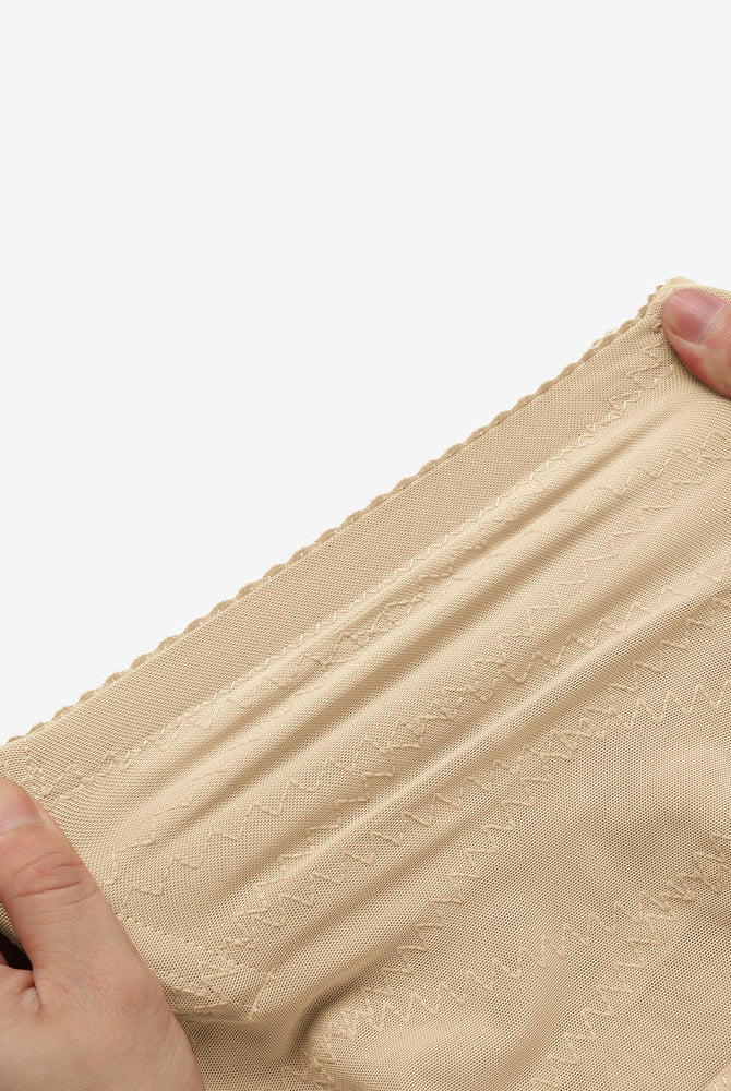 Beige mesh tummy control shapewear. High-waisted design, firm waist, breathable fabric.