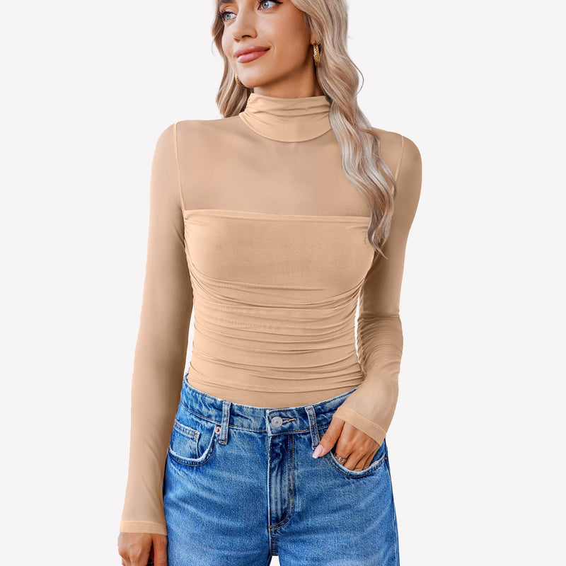Nude mesh bodysuit with turtleneck and ruched front, paired with blue jeans. Going out outfit.