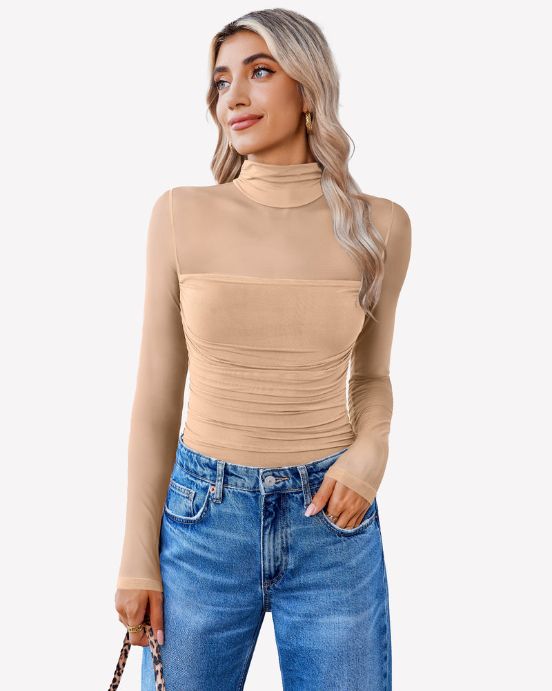 Nude mesh bodysuit with turtleneck and ruched front, paired with blue jeans. Going out outfit.