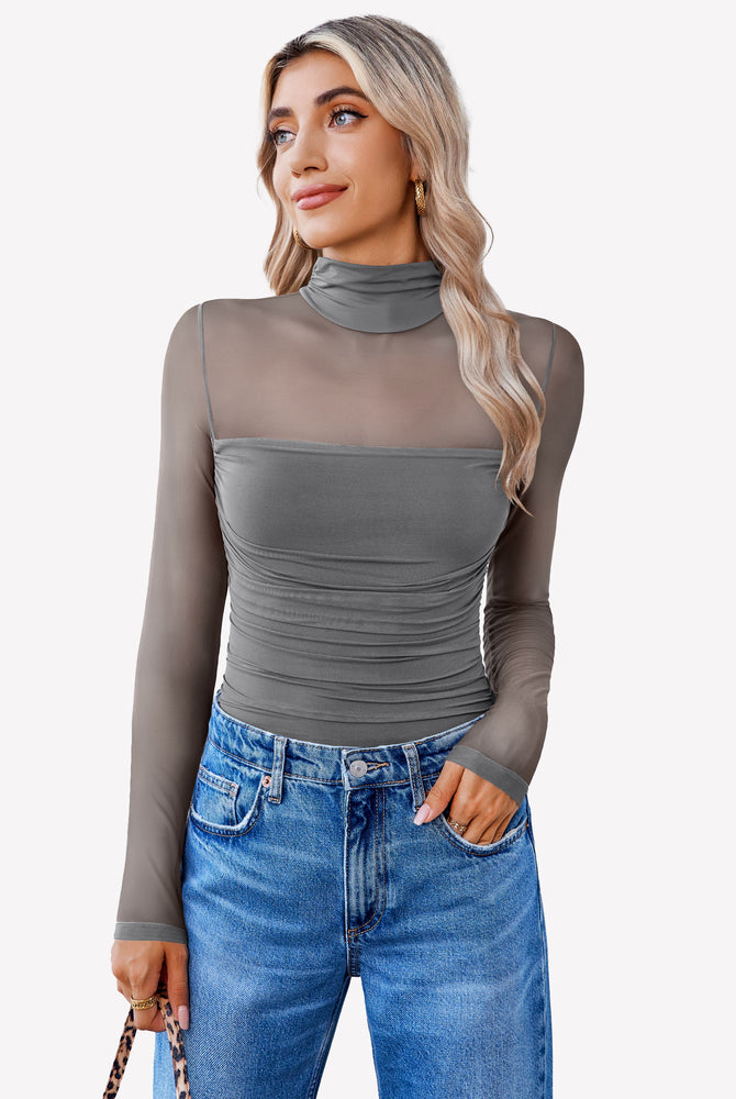 Grey mesh turtle neck bodysuit with ruched front and blue jeans. Perfect going out outfit for women.