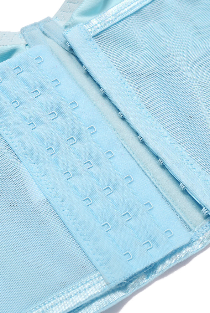 Light blue corset top hook and eye closure detail with mesh and adjustable straps.