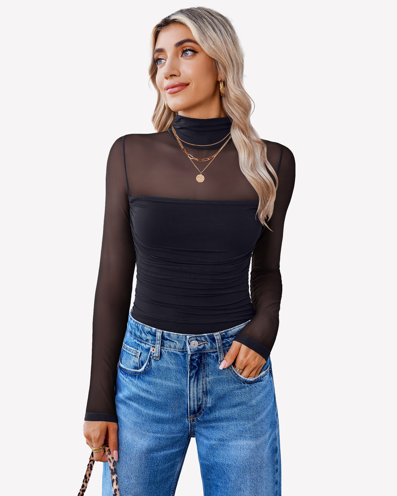 Black mesh sleeve turtle neck bodysuit with ruched front, paired with blue jeans for women.
