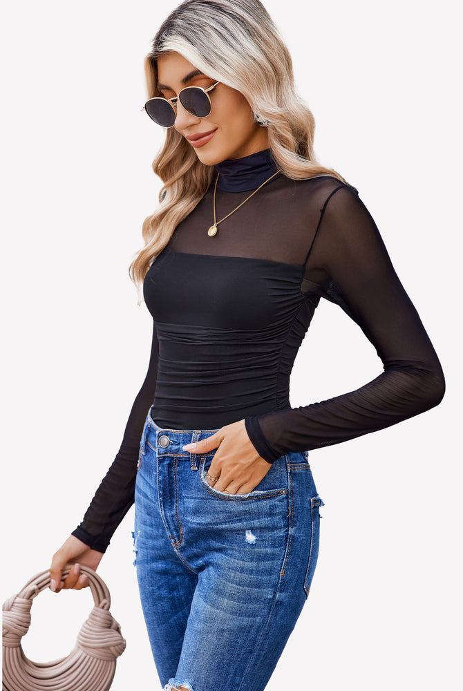 Black mesh sleeve turtle neck bodysuit and blue jeans, perfect going out outfits for women.