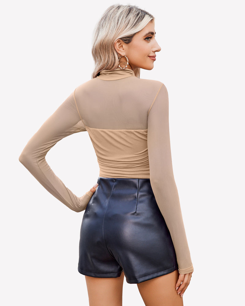 Nude mesh turtleneck bodysuit with ruched front, black shorts. Going out outfit for women.