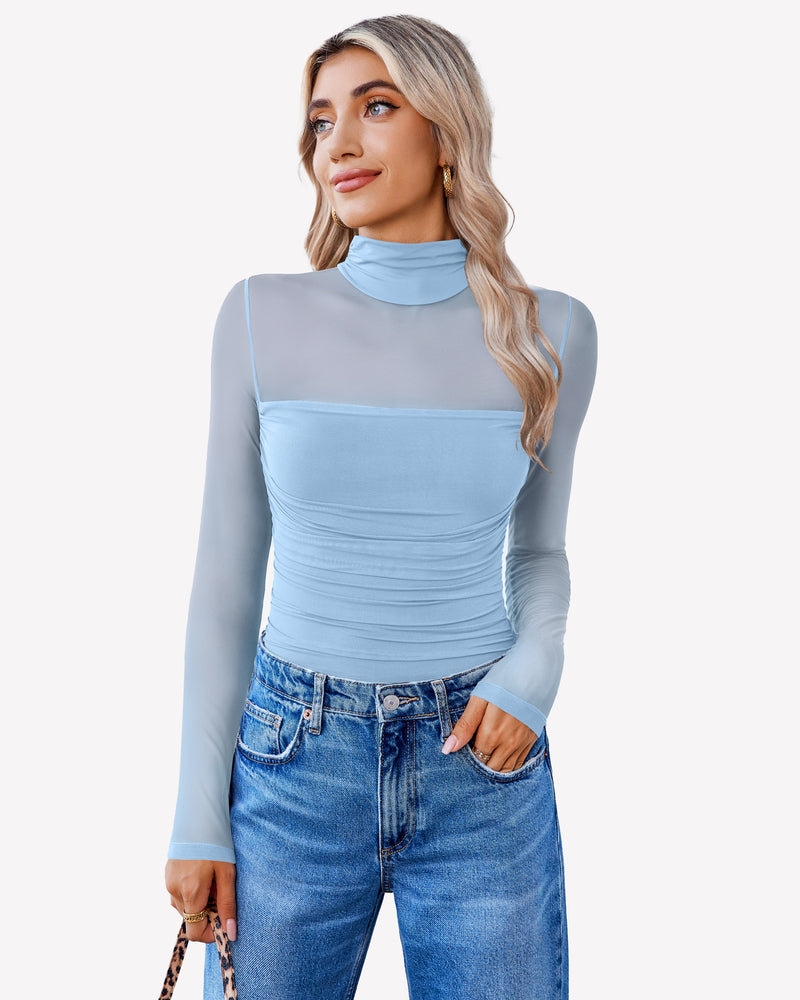 Light blue mesh turtleneck bodysuit with ruched front, styled with blue jeans.