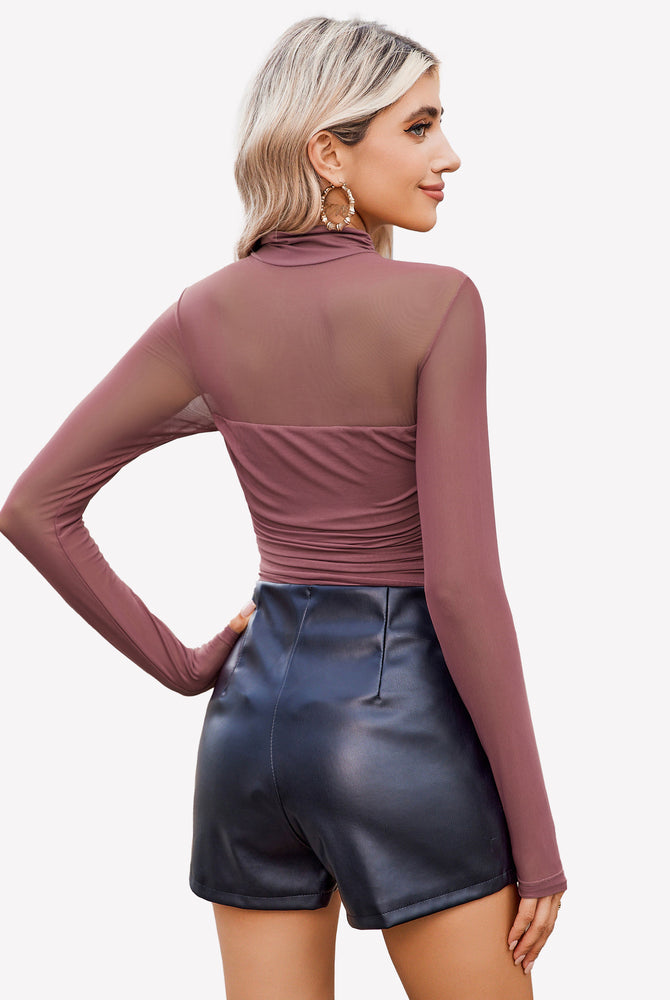 Mesh turtle neck bodysuit with ruched front, black shorts. Perfect going out outfit for women.